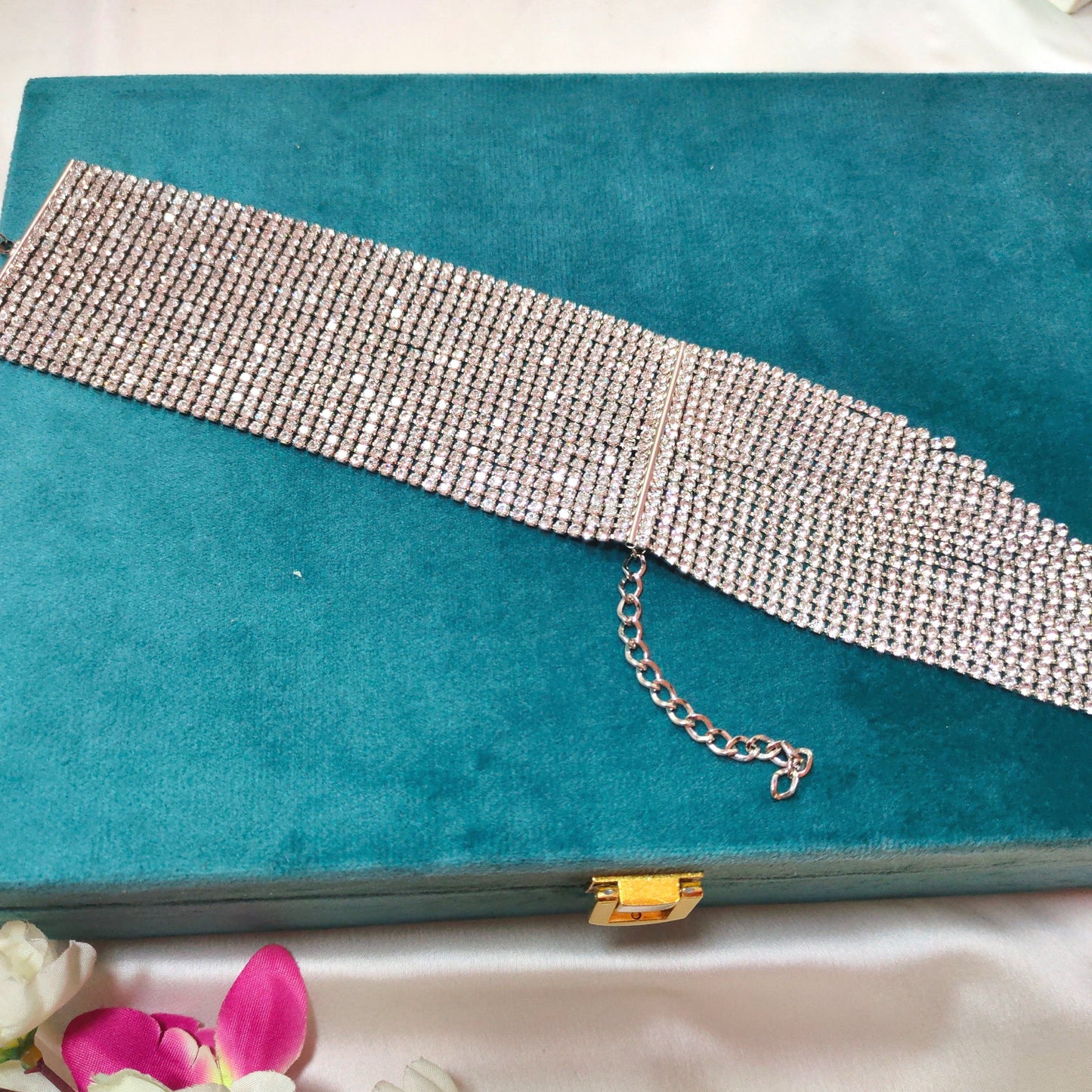 silver cocktail bracelet on the blue box top-front view