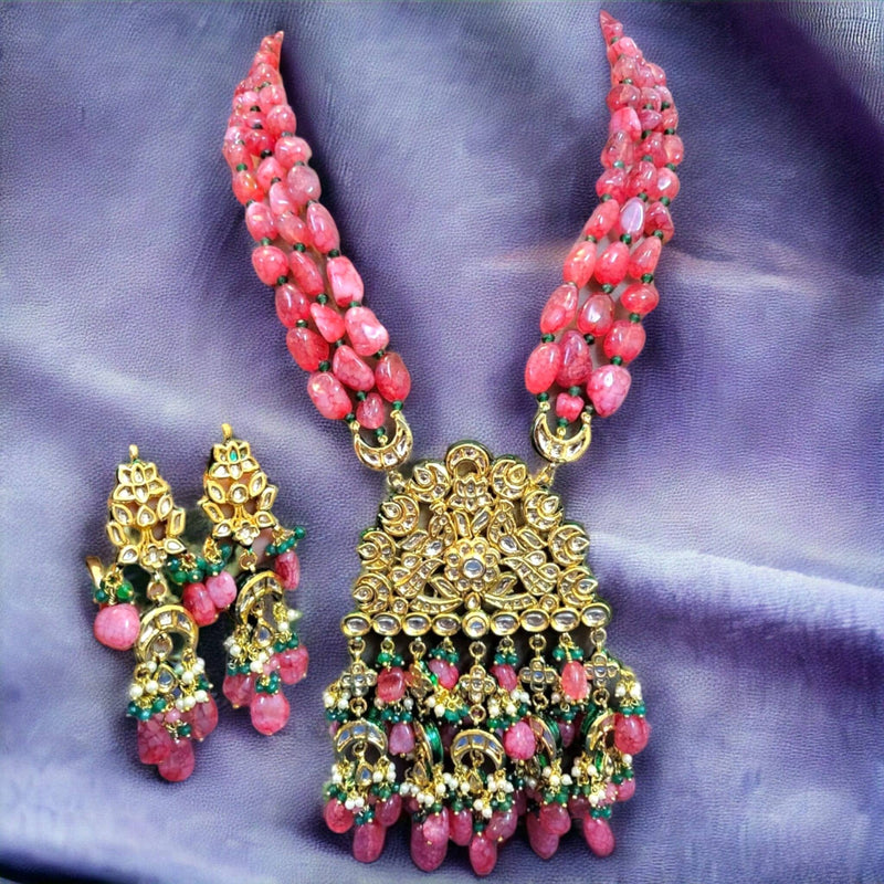 Aashna kundan raani haar necklace set with earring on the blue background