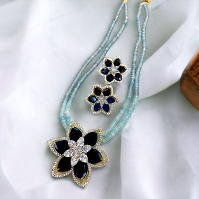 Flower broach semi-precious set in aqua color
