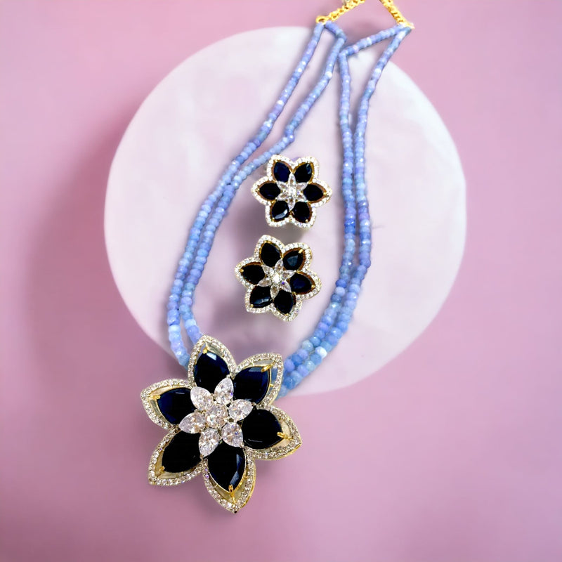 Flower broach semi-precious set in smoky blue color