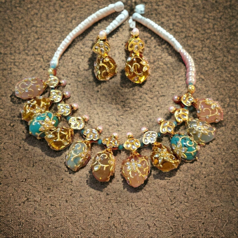 lash semi precious necklace set with earring on the floor