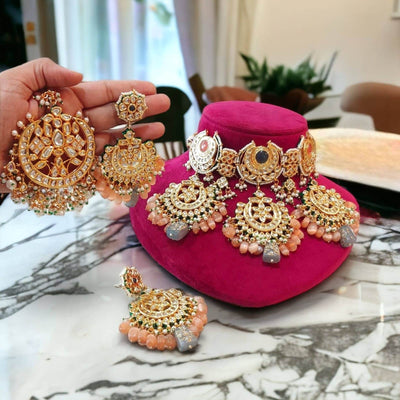 Ratna kundan necklace set with oversized tikka and chand bali style earrings in peach color