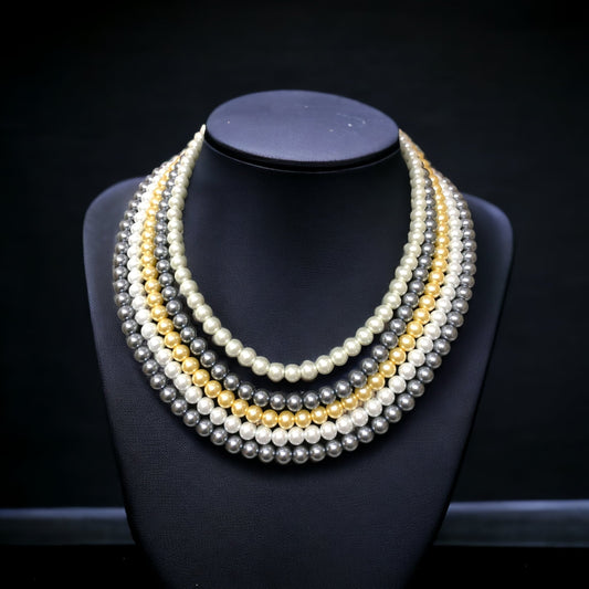 Raza 20-inch multi-colored pearl necklace features five layers on the black background