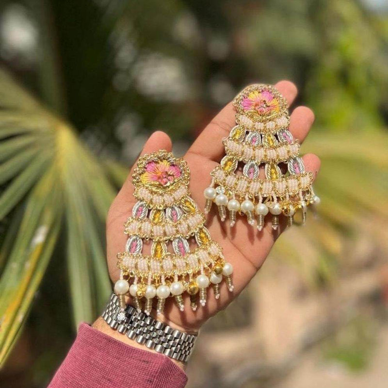 showing Beautiful Jardoji Dangler Earrings on the hand