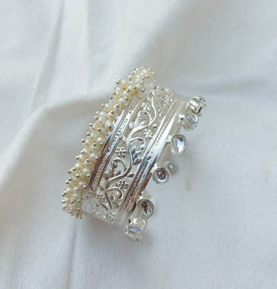 silver bangles made with kundan & pearl.