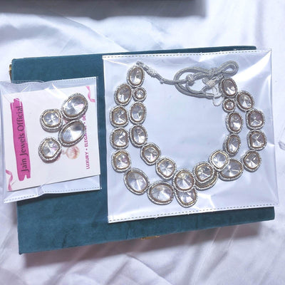 Perila silver foiled uncut kundan necklace and an earring is in the plastic bag