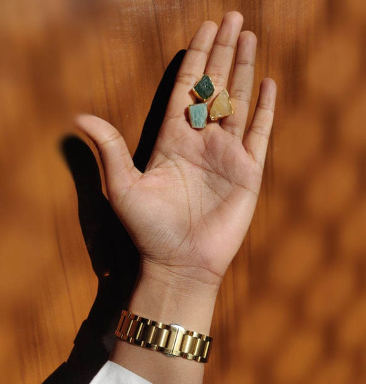 A lady shows a Semi Precious uncut genstone ring on her hand