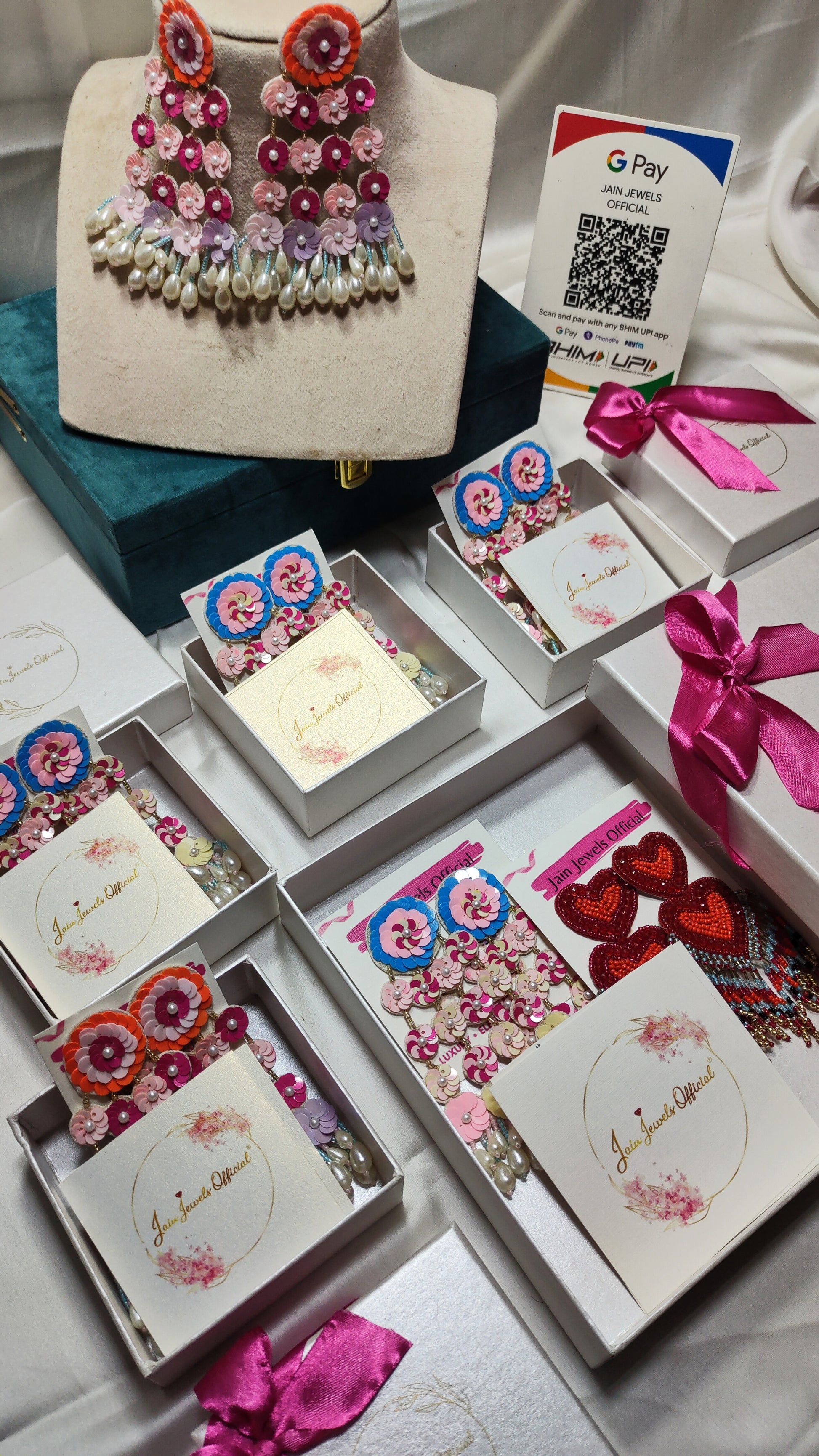 multiple colourful jhoomer style earrings and box 
