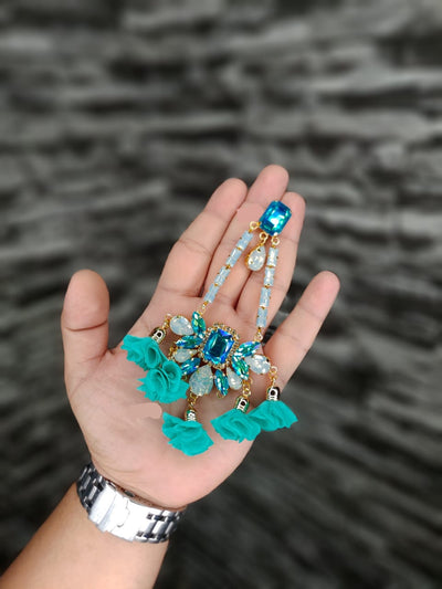 floral jhoomer danglers in firoja color on hand
