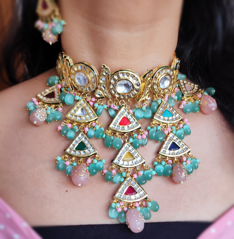 A lady wears a kanika navratan layered kundan necklace