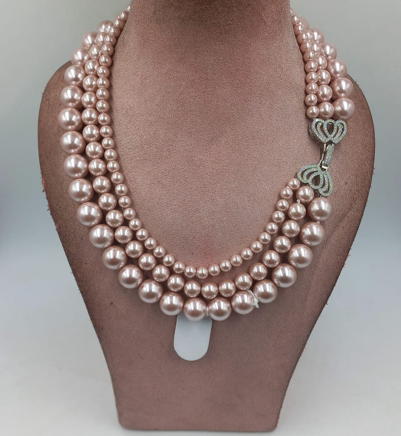 malhaar pearl necklace with diamond broach in rose pink color